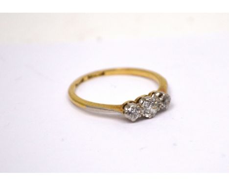 An 18ct yellow gold three-stone diamond ring, size K 1/2, approx 1.8g.