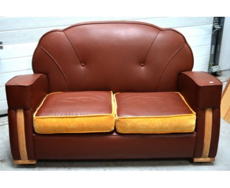 A 1930s vinyl upholstered Art Deco style sofa with curved button back, length approx 135cm.