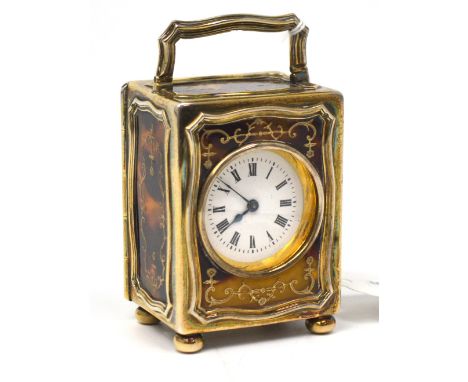 A French miniature carriage clock in a George V hallmarked silver, tortoise shell and silver pique case with carrying handle,