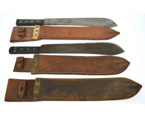 A WWII Martindale 945 machete in leather scabbard, a WWII 1943 machete and a leather case for a machete (3).