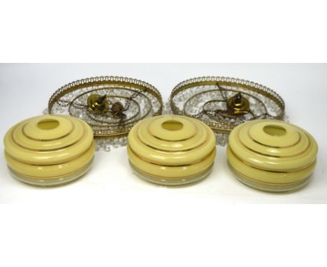 A pair of cut glass chandelier-style light fittings and three c1950s glass circular yellow and white ceiling light shades (5)