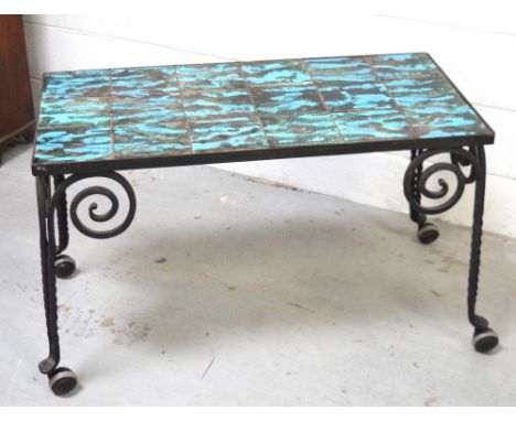 A 1970s wrought iron green and turquoise tile-top table.