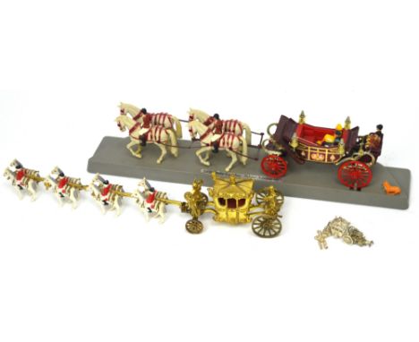 A Queen Elizabeth II Coronation coach and horses set, a Silver Jubilee commemorative coach and horses set, a Sterling silver 