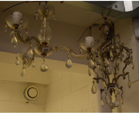 An ornate silvered and cut glass decorative ceiling light, length 56cm and a cut glass three-branch decorative electrolier, l