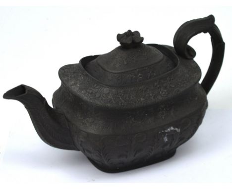 A late 18th century black basalt teapot with floral leaf and fern decoration and a floral knop, length 26cm, and a 19th centu