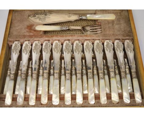 A Victorian oak-cased set of twelve fish knives, forks and servers with mother of pearl handles.