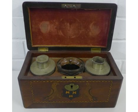 A mahogany and chequer banded tea caddy, the front decorated with bird and crest pattern, the hinged lid opening to reveal tw