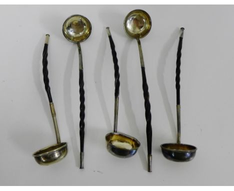 A set of five white metal and whale bone handled toddy ladles, likely Scottish, 20cm long (5) 