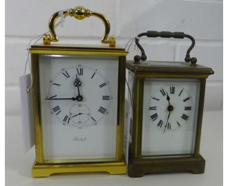 A small brass cased and glass panelled carriage clock, 15cm high,  together with a modern carriage clock (2) 