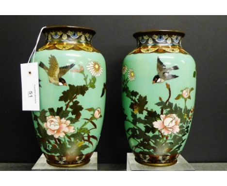 A pair of Cloisonne baluster vases, the jade green ground with bird, butterfly and floral pattern within stylised borders, 21