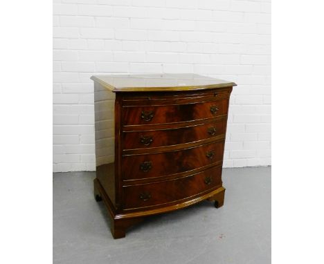 A mahogany bow fronted chest with pull out slide over four long drawers on bracket supports, 78 x 71cm