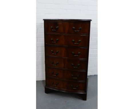 A mahogany tallboy chest, the bow fronted top over six long drawers on bracket supports, 105 x 61cm