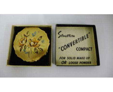 A vintage gilt metal Stratton powder compact in its original box