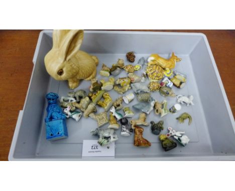 A quantity of animal figurines to include a Sylvac bunny, Wade whimsies and a Beswick corgi etc., (a lot) 