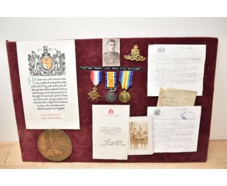 A WWI 1914-15 Trio, 1914-15 Star, War and Victory Medals to 726GNR.R.Lloyd.R.F.A along with Memorial Plaque and Scroll, Cap B