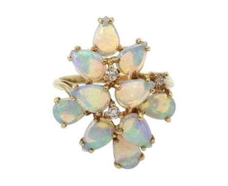 9ct gold opal and diamond stepped design ring, three round brilliant cut diamond set amongst ten pear shaped opals, hallmarke