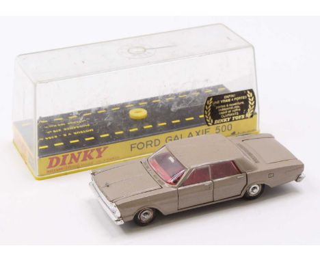 A French Dinky Toys No. 1402 Ford Galaxy 500 comprising of a light brown body with red interior and detailed hubs, housed in 