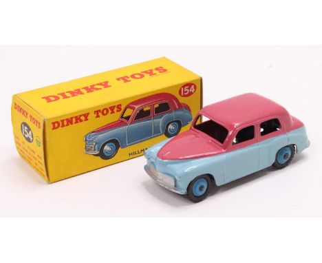 Dinky Toys No. 154 Hillman Minx saloon comprising of two-tone light blue and cerise body with mid-blue hubs and housed in the