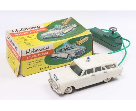 A Marx Toys plastic and battery operated model of a Motorway Police Patrol car, housed in the original card box, with green p