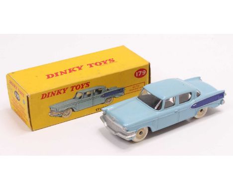 A Dinky Toys No.179 Studebaker President Sedan comprising light blue and dark blue body with cream hubs and white tyres, hous