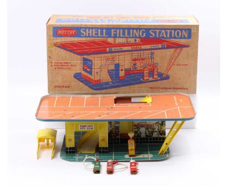 A Mettoy Playthings No. 6275 large scale tin plate model of a Shell filling station, housed in the original buff coloured car