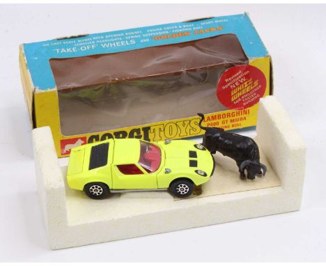 A Corgi Toys No. 342 Lamborghini P400 GT Mura, comprising of fluorescent yellow body with red interior and bull figurine, hou