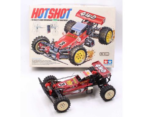 A Tamiya 5847 1/10 scale radio controlled kit built model of a Hot Shot 4-wheel drive off-road racing car, complete with orig