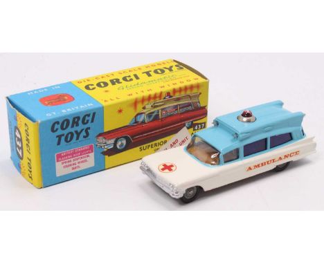 A Corgi Toys No. 437 Super Ambulance on Cadillac chassis, comprising white and light blue body with cast work hubs, housed in