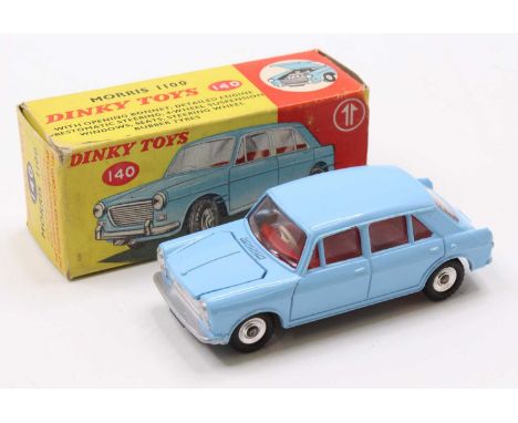 A Dinky Toys No. 140 Morris 1100 comprising of light blue body with red interior and spun hubs, complete in the original card