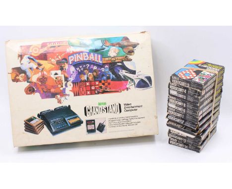 Boxed Adman Grandstand Video Game Console together with a quantity of game cartridges