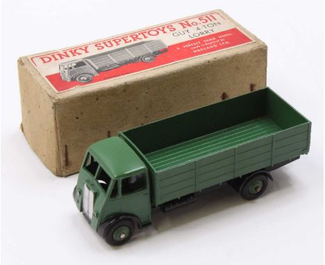 Dinky Toys No. 511 Guy 4 ton lorry with first type cab comprising green cab and back with black chassis and green hubs in the