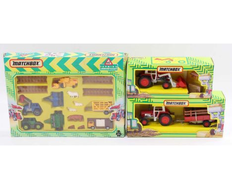 A Matchbox German issue farming gift set and diecast group to include an FM-6 tractor and hay trailer, together with an FM-3 