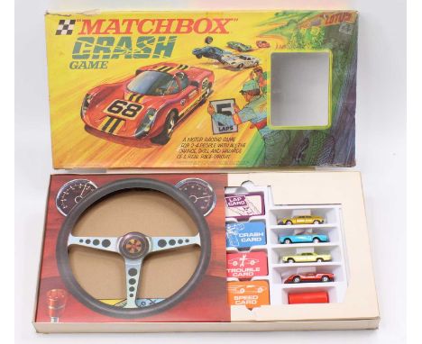 A Matchbox Crash Game comprising four various Superfast diecast vehicles, shaker, various playable game cards, instruction le