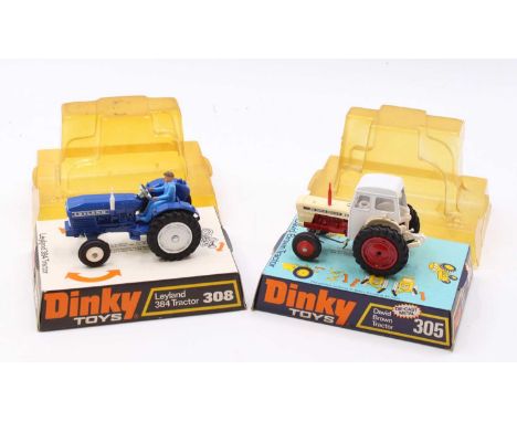 A Dinky Toys bubble packed diecast tractor group to include a No.305 David Brown tractor comprising red &amp; white body, in 