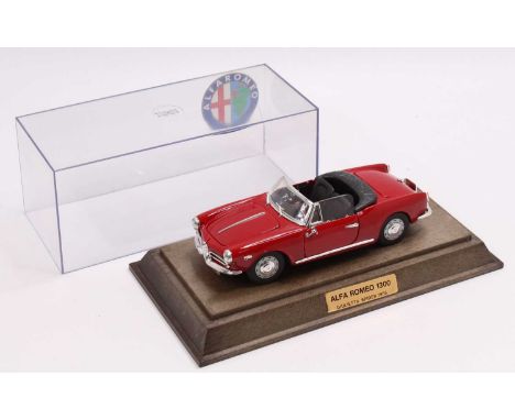 A Togi Toys of Italy 1/24th scale diecast model of an Alfa Romeo 1300 Spider, red body, with chrome bright work, attached to 