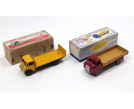 Dinky Toys boxed model group, 2 examples comprising No. 513 Guy Flat Truck with tailboard, yellow body and back, dark blue ch