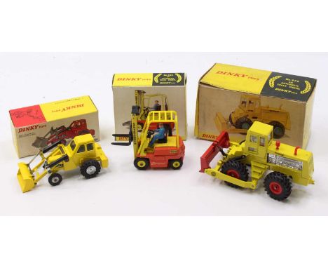 A Dinky Toys commercial vehicle and earth moving diecast group to include a No. 976 Michigan 180-3 tractor dozer, together wi