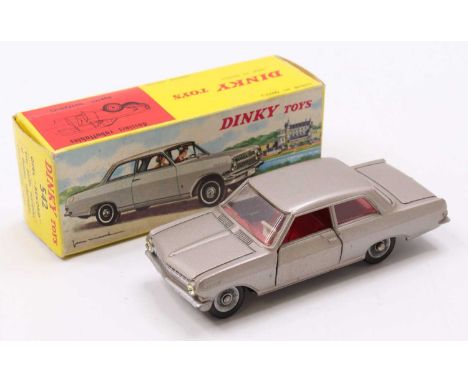 A Dinky Toys No. 542 Opal Rekord, comprising of light metallic grey body with red interior and spun hubs, housed in the origi