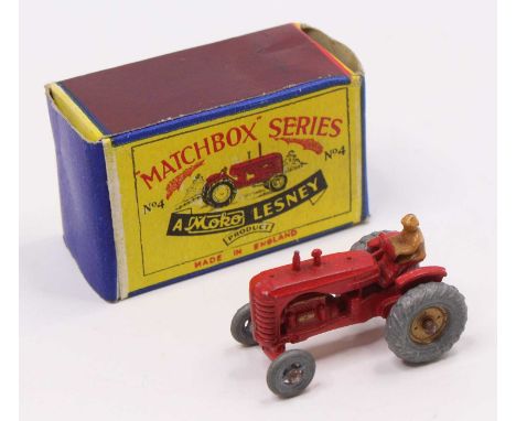 Matchbox Lesney No. 4 Massey Harris Tractor in red, a first issue without mudguards, with gold trim and driver figure, sold i