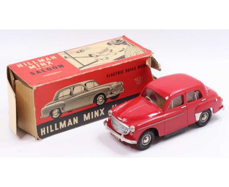 Victory Industries 1/18th scale plastic battery operated model of a Hillman Minx De Luxe Saloon comprising a red body, with a