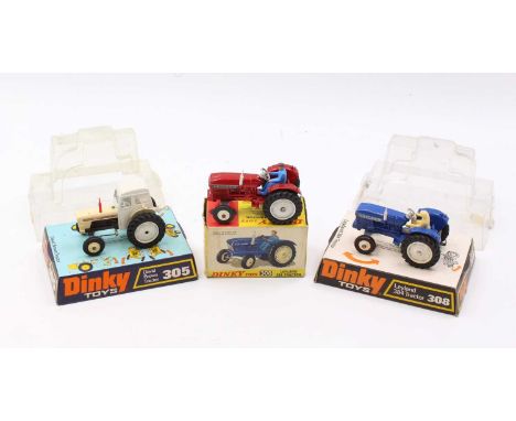 A collection of three various Dinky Toy farming agricultural diecast vehicles to include a No. 308 Leyland 384 tractor finish
