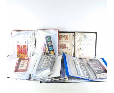 An album of Vintage banknotes, and albums of British Mint postage stamps 