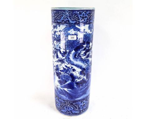 A Chinese ceramic stick stand, with blue and white blossom and bird decoration, 60cm 