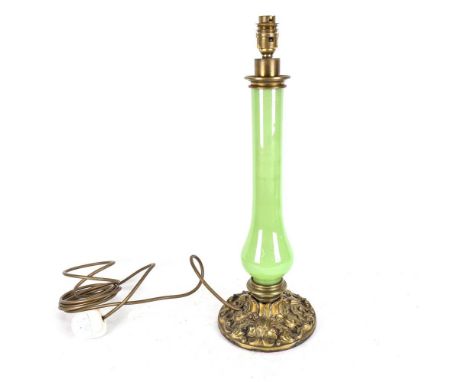 A green glass table lamp, on embossed brass base, height 48cm overall