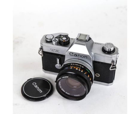 CANON - a Vintage TX 35mm single lens reflex camera, with Canon 50mm 1:1.8 lens and Hunter 55mm filter 