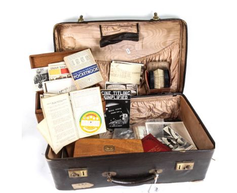 A Vintage suitcase containing various items, including RAF photograph, clothes brushes, silver plated cutlery etc 