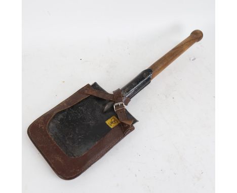 A Second World War British army German-Pattern trench shovel, with original leather cover and broad arrow stamp, length 56cm