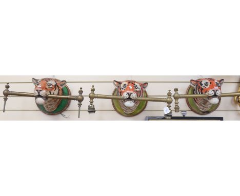 A set of 3 painted plaster tiger wall light sconces, brass pole lengths 52cm (3) 