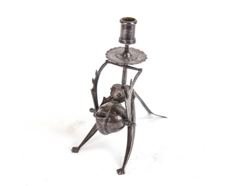 A Middle Eastern deskstand with Damascene decoration, comprising candleholder, pen rack and inkwell, height 22cm 