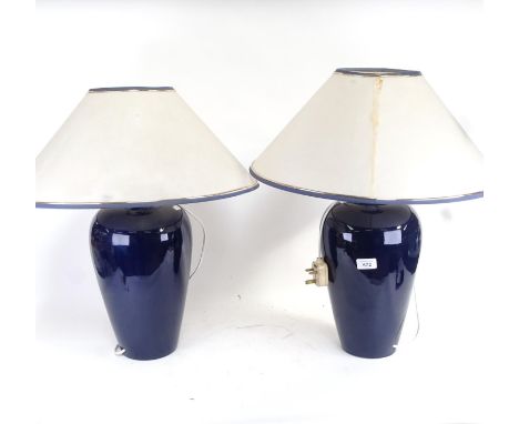 A pair of blue glazed ceramic table lamps, and shades, height 58cm overall 